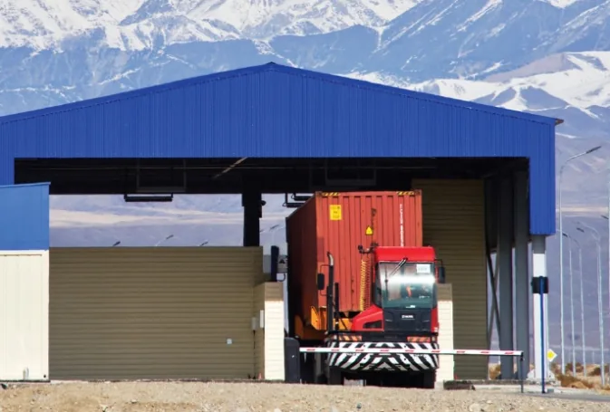 Container truck passing through a vehicle radiation screening portal at a land border crossing