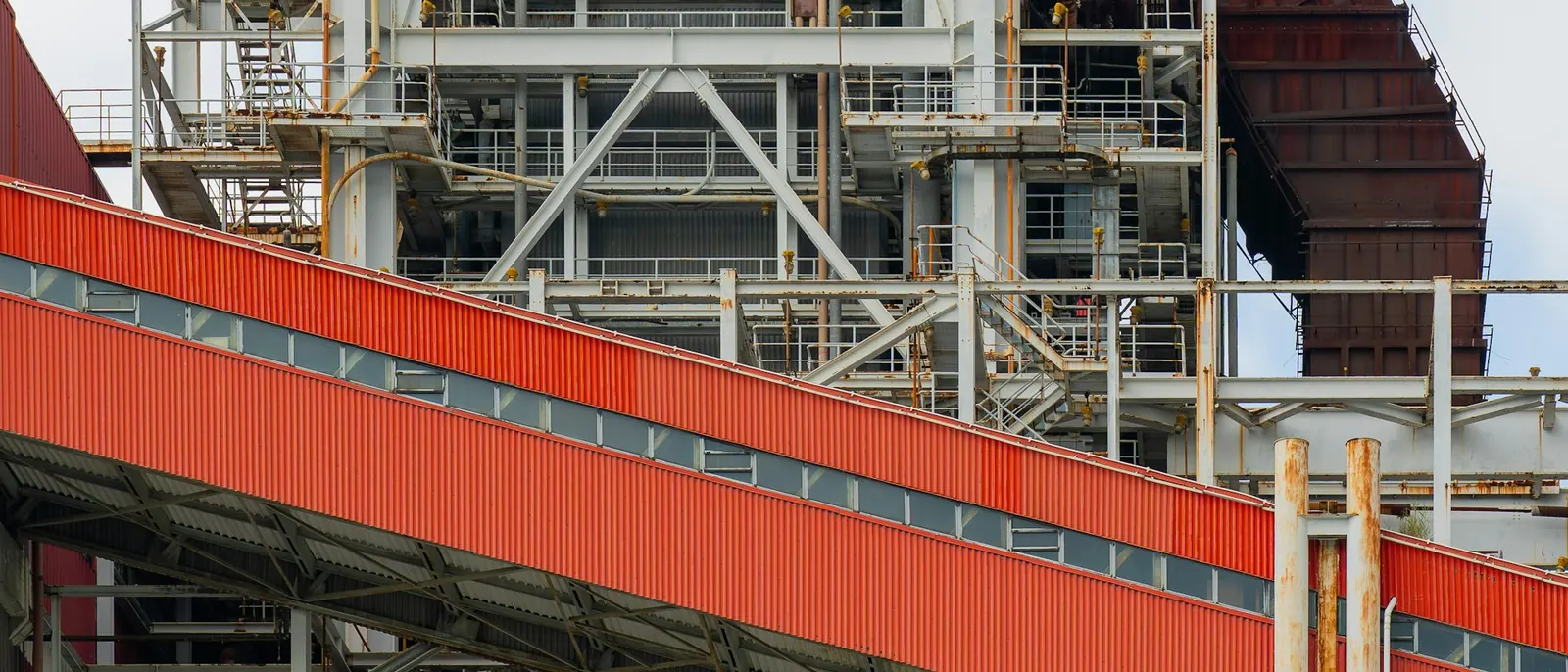 Enclosed belt conveyor gallery at an industrial plant